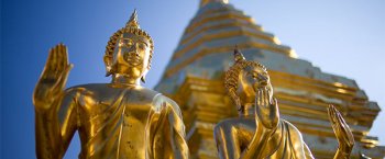 A look at some golden statues in front of a temple in Chiang Mai in Northern Thailand.