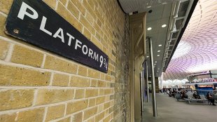 Platform 9 and 3/4 on the departure concourse of King's Cross Station. Board from this hidden platform.