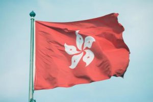 The Hong Kong flag waves in the wind. - Kick Images/Photodisc/Getty Images